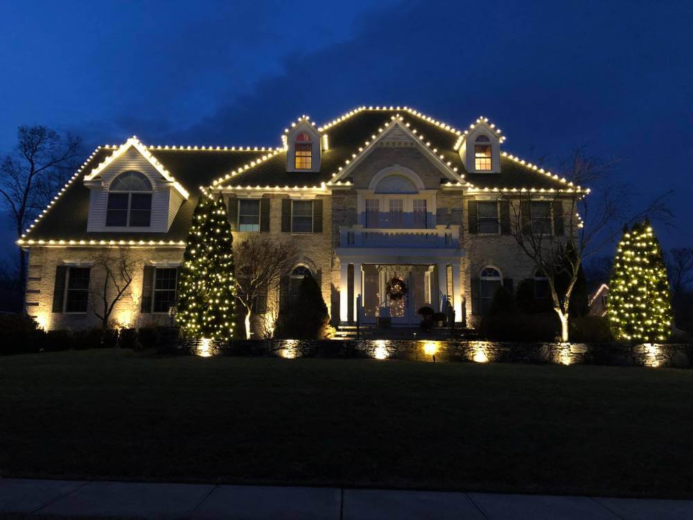 House lightings illuminating the exterior of a beautiful home