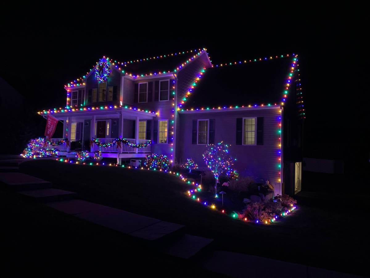 holiday lights on white home