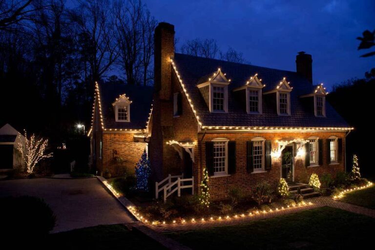 a house decorated with beautiful lights, creating a warm and inviting ambiance