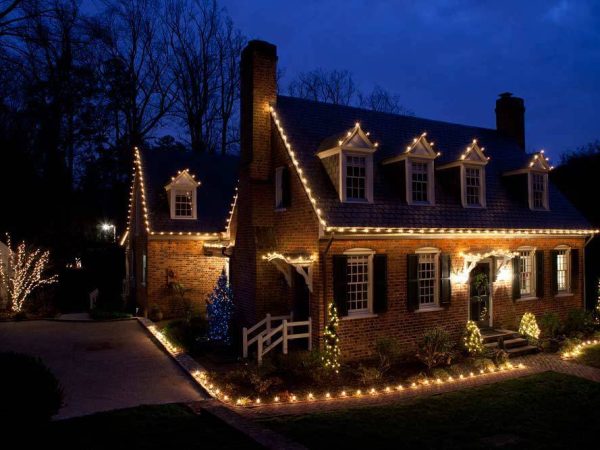 a house decorated with beautiful lights, creating a warm and inviting ambiance